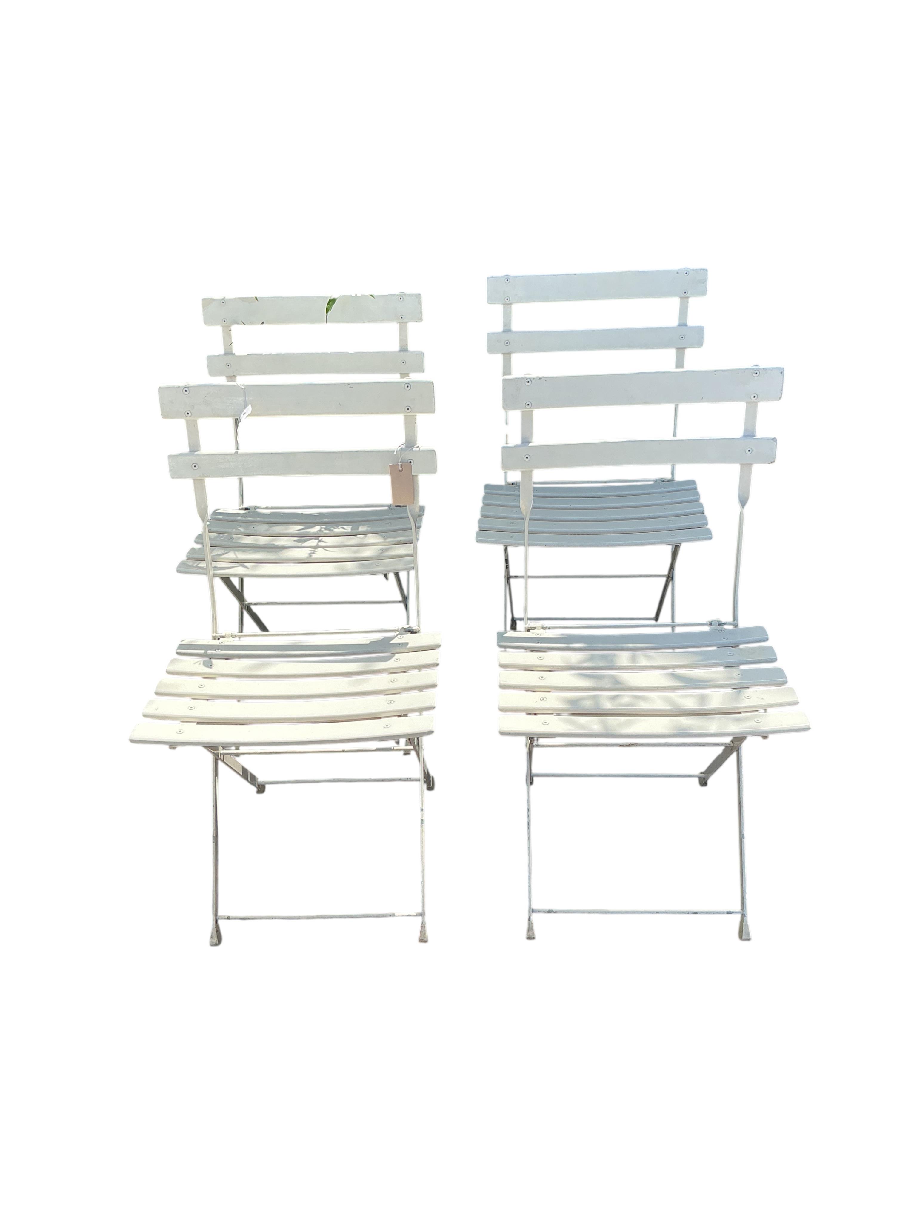 A set of four Emu (Italian) painted metal folding garden chairs
